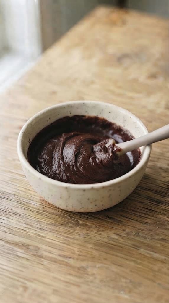 Thick extra-fudgy brownie batter after flour, cocoa powder, and salt have been gently folded in