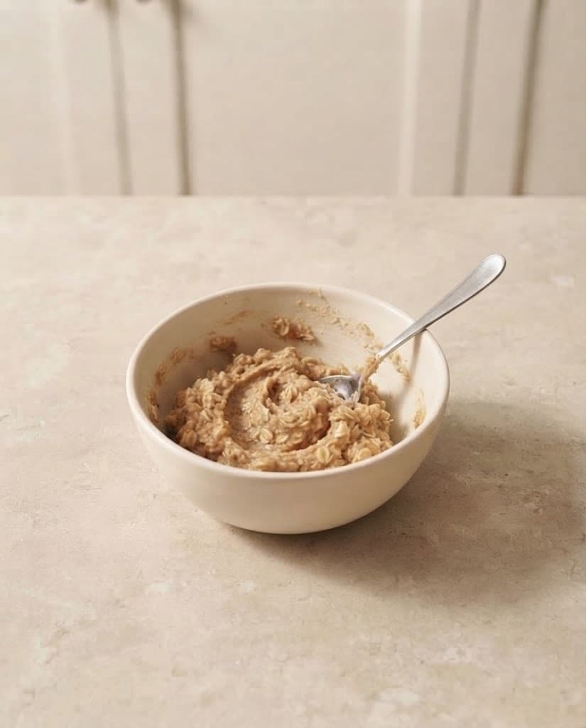 Soft oatmeal cookie dough with visible rolled oats after the dry ingredients have been mixed in